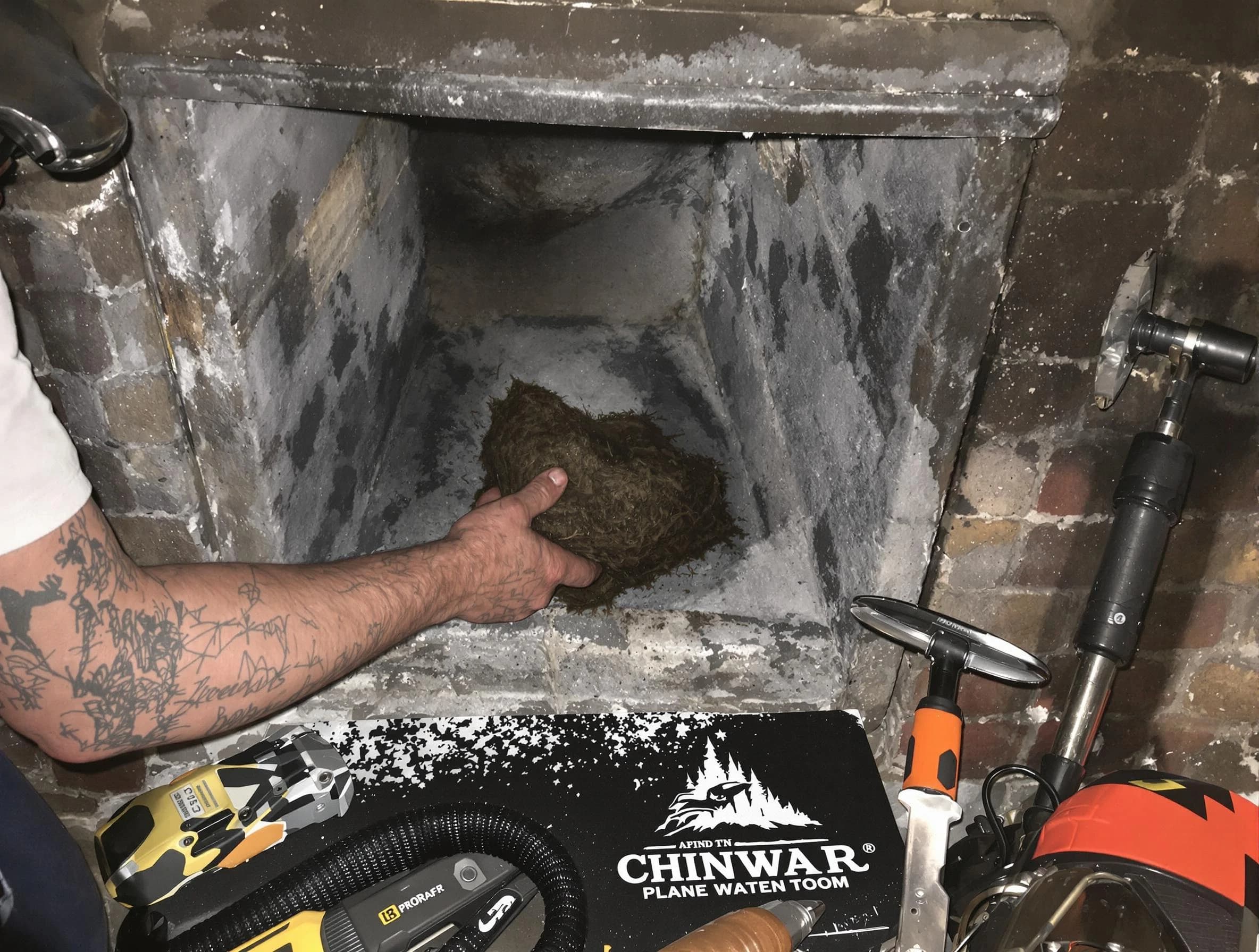 Yukon Chimney Sweep safely removing debris and screening chimney in Yukon, OK
